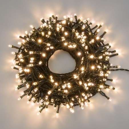 Tira de 100 LED cálidos enlazables, 6,5 metros de luz fija con cable verde.