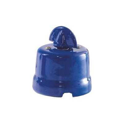 Comutador de porcelana com laço de cor vermelha.